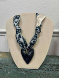 black satin scarf with chunky heart necklace