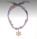 pink scarf and flower charm necklace